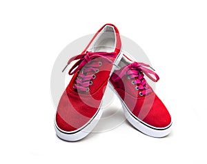 A pair of red color canvas shoes isolated on white