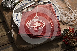 Pair of Red Folded Napkins on Plate with Christmas Decor