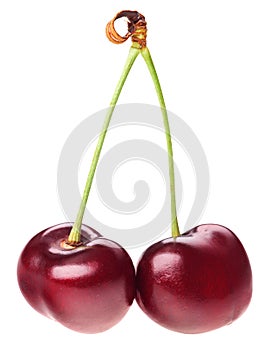 Pair of red ripe cherry fruit with green stem
