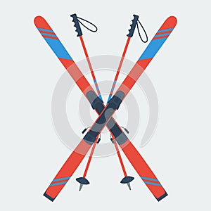 Pair of red skis and ski poles photo