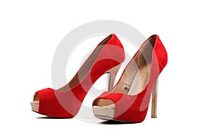 Pair of red women`s high heel shoes isolated on white background