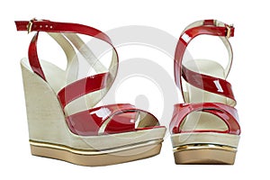 A pair of red women's sandals on a white background