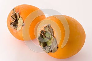 Pair of ripe persimmons