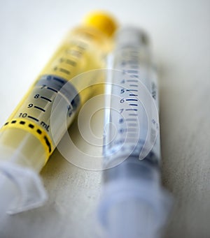 Pair of saline and heparin syringes