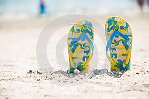 Pair of sandals in sand beach