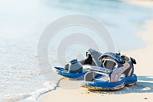 A pair of sandals on a tropical