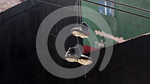 A pair of shoes hanging