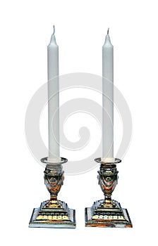 Pair of silver candlesticks isolated on white