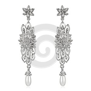 Pair of silver diamond earrings isolated on white