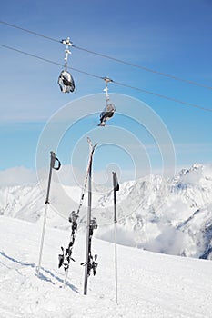 Pair of ski and poles stick out of snow