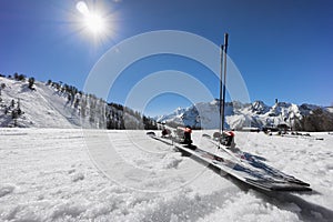 Pair of skis on slope in the snow