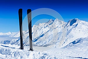 Pair of skis in snow. Winter vacations