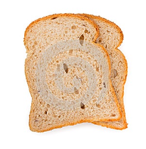 Pair of slices of fresh oat bread isolated on a white background. Top view, close up