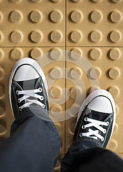 A pair of sneaker on non slip flooring