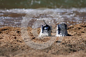 Pair of sneakers on beach