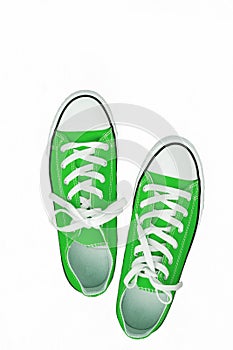 pair of sneakers-colored youth running shoes on a white background, isolated