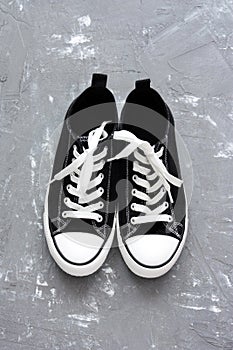 Pair of sneakers on greay background photo