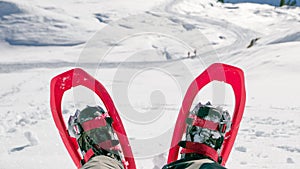 Pair of snowshoes on Man`s legs