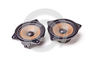 Pair of speakers of an acoustic system - an audio for playing music in a car interior on a white isolated background in a photo