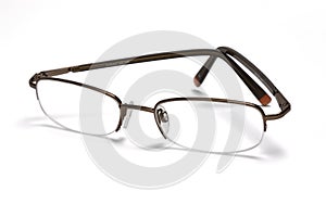A pair of specticals on a white background, with a drop shadow.
