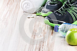 Pair of sport shoes and fitness accessories