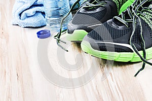 Pair of sport shoes and water bottle