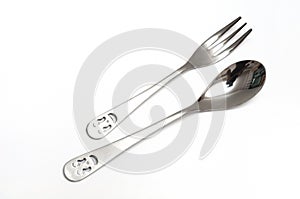 A pair of stainless steel cocktail spoon and fork