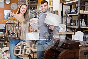 pair standing with purchases in furnishings store