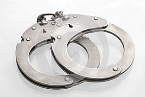 Pair of steel handcuffs close up, Silver metal handcuffs