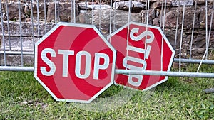 A pair of stop signs