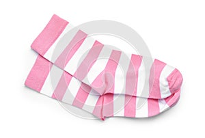 Pair of striped pink socks on white background, top view