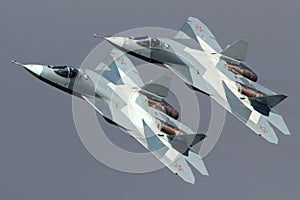 Pair of Sukhoi T-50 PAK-FA 052 BLUE and 051 BLUE modern russian jet fighters performing demonstration flight in Zhukovsky