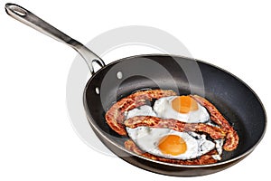 Pair Of Sunny Side Up Chick Eggs Fried With Four Bacon Rashers In Old Frying Pan Isolated On White Background