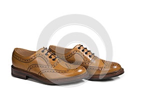 Pair of Tanned Brogue Derby Shoes of Calf Leather with Rubber Sole In One Line Over Pure White Background