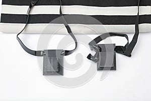 Pair of tefillin , A symbol of the Jewish people, a pair of tefillin with black straps, isolated on a white background