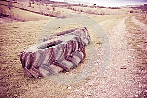 Pair of tires of a big tractor dismantled and left in a Italian