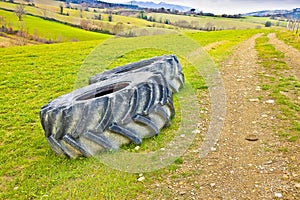 Pair of tires of a big tractor dismantled and left in a Italian