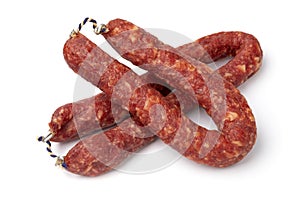 Pair of traditional Dutch Metworst, preserved pork sausage, close up on white background