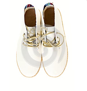 Pair of trendy canvas shoes isolated on white top view