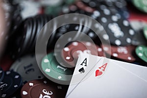A pair of two aces with poker chips
