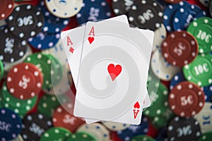A pair of two aces with poker chips