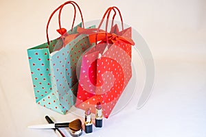 A pair of valentines day gift shopping bag for woman with cosmatics gift for loved ones with lipstick