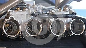 Pair of vehicle carburetors.