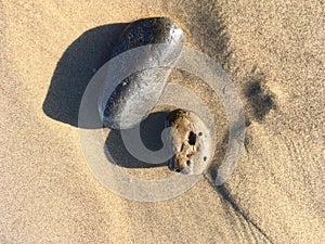 Pair of Water Worn Rocks on Beach Sand Zen