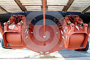 Pair of waterjets in the stern of a coastguard docked in drydock.