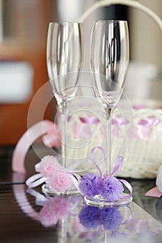 A pair of wedding glasses and a basket