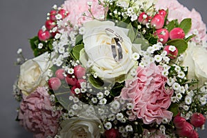 Pair of wedding rings flowers bridal bouquet