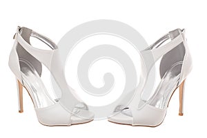 Pair of white high heel woman shoes