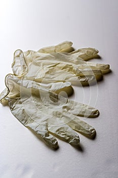 A pair of white latex gloves on white background, medical gloves close-up - Image