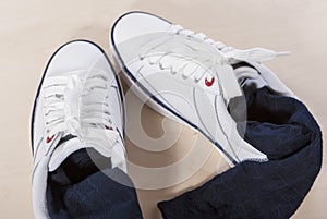 Pair of White Trainers with Socks Inserted Inside